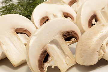 Image showing Sliced Champignon mushrooms on a plate