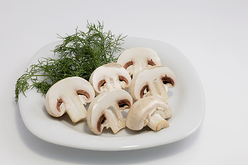 Image showing Sliced Champignon mushrooms on a plate