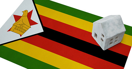 Image showing Small house on a flag - Zimbabwe