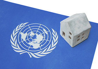 Image showing Small house on a flag - UN