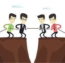Image showing Two groups of business people pulling rope.