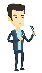 Image showing Barber holding comb and scissors in hands.