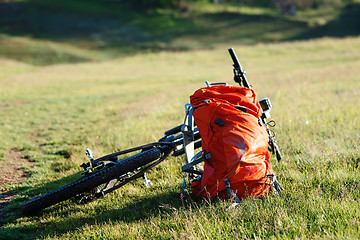 Image showing Bicycle with orange bags for travel