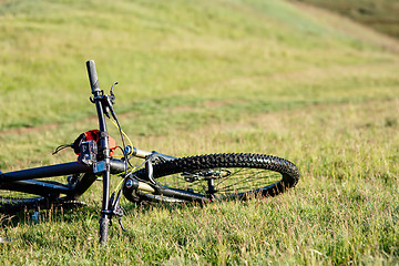 Image showing Bicycle with orange bags for travel