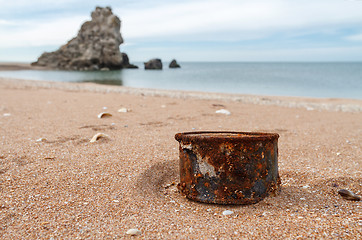 Image showing Rusty tin can on the beach
