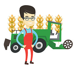 Image showing Farmer standing with combine on background.