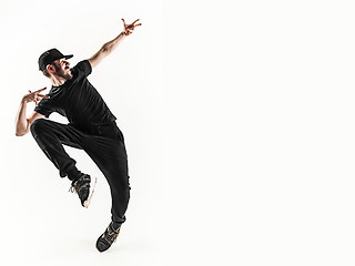 Image showing The silhouette of one hip hop male break dancer dancing on white