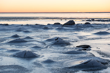 Image showing Sunset view at an ice covered coastline