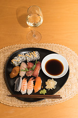 Image showing Sushi meal with white wine