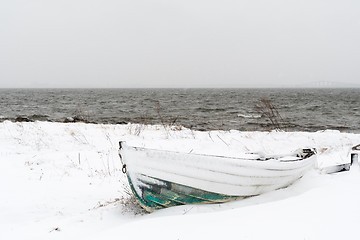 Image showing Vintage rowing boat in snow