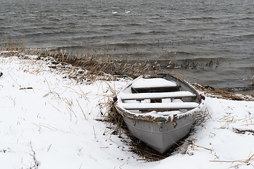 Image showing Snowy vintage rowing boat