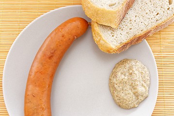 Image showing tasty sausages with bread and mustard