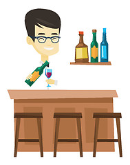 Image showing Bartender standing at the bar counter.