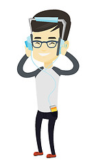 Image showing Young man in headphones listening to music.