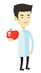 Image showing Nutritionist offering fresh red apple.