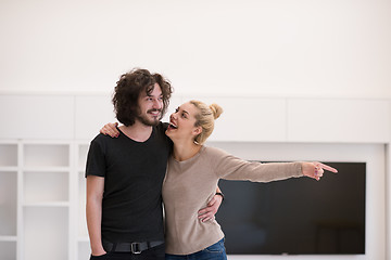 Image showing couple hugging in their new home