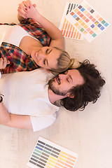 Image showing Happy young couple relaxing after painting