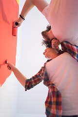 Image showing couple painting interior wall