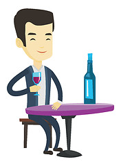 Image showing Man drinking wine at restaurant.