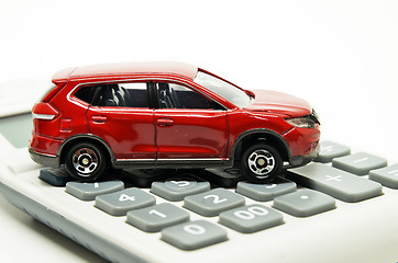 Image showing Calculator and red toy car