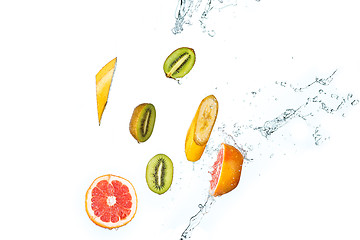 Image showing Fresh fruits falling in water splash, isolated on white background