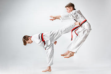 Image showing The studio shot of group of kids training karate martial arts