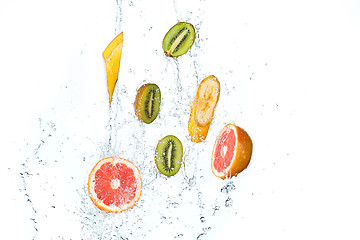 Image showing Fresh fruits falling in water splash, isolated on white background