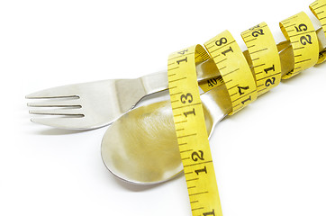 Image showing Steel spoon a fork and measuring tape