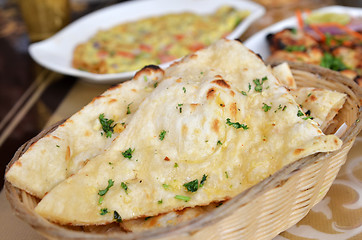 Image showing Garlic and coriander naan on a basket