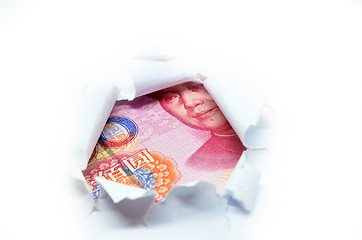 Image showing China currency through torn white paper