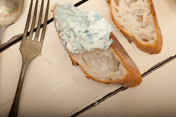 Image showing fresh blue cheese spread ove french baguette