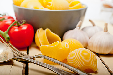 Image showing Italian snail lumaconi pasta with tomatoes