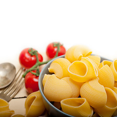 Image showing Italian snail lumaconi pasta with tomatoes