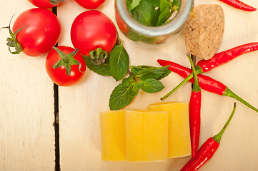 Image showing Italian pasta paccheri with tomato mint and chili pepper