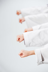 Image showing The studio shot of group of kids training karate martial arts