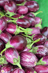 Image showing Fresh eggplants for sale in a market