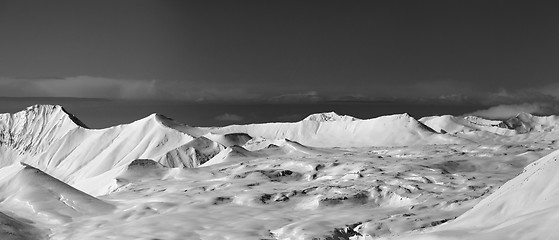 Image showing Black and white panoramic view on snowy plateau in winter