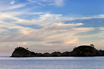 Image showing Island in sea and beautiful sky with clouds at sunset