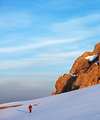 Image showing Hiker at sunrise snow mountains