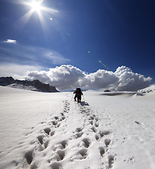 Image showing Two hikers on snow plateau.