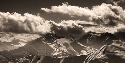 Image showing Sepia evening mountains and sunlight clouds