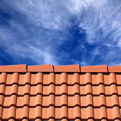 Image showing Roof tiles and sky with clouds at sun day