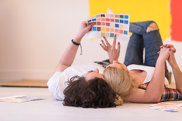 Image showing Happy young couple relaxing after painting