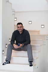 Image showing man sitting on the stairs