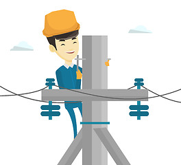 Image showing Electrician working on electric power pole.