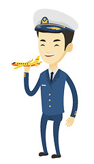 Image showing Cheerful airplane pilot with model of airplane.