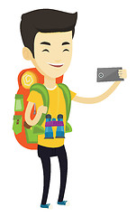 Image showing Man with backpack making selfie.