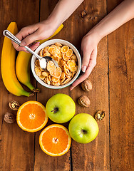 Image showing Healthy home made breakfast of muesli, apples, fresh fruits and walnuts