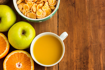 Image showing Healthy home made breakfast of muesli, apples, fresh fruits and walnuts