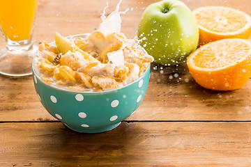 Image showing Healthy home made breakfast of muesli, apples, fresh fruits and walnuts